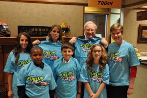 Warren Buffett and GENYOUth Foundation CEO, Alexis Glick, with the five student winners.